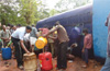 Locals have field day as petrol tanker overturns